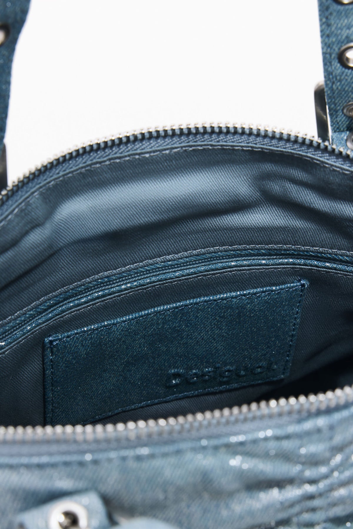 Desigual Medium-sized backpack made of blue denim fabric with a ruched finish on the front.