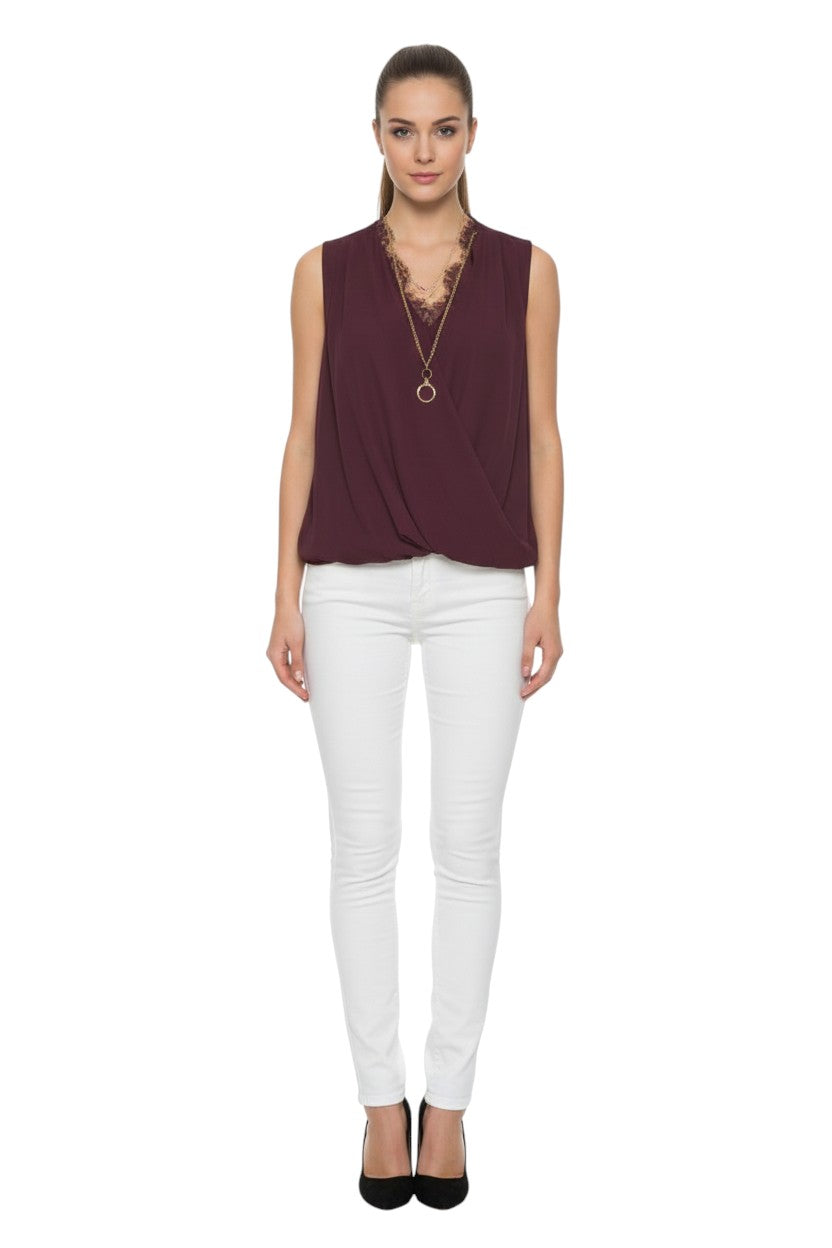 BSB Sleeveless wrap blouse with lace and bejeweled necklace
