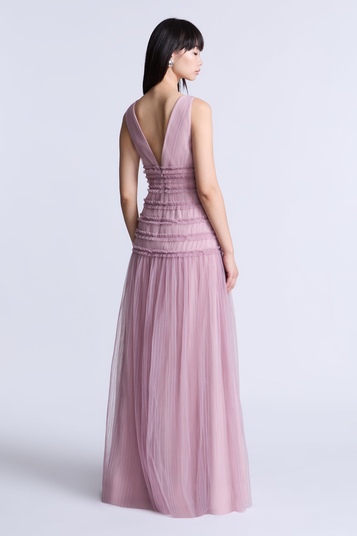 BCBGMAXAZARIA Iris Gown Softly pleated crafted from airy tulle with a fluid weightless feel.