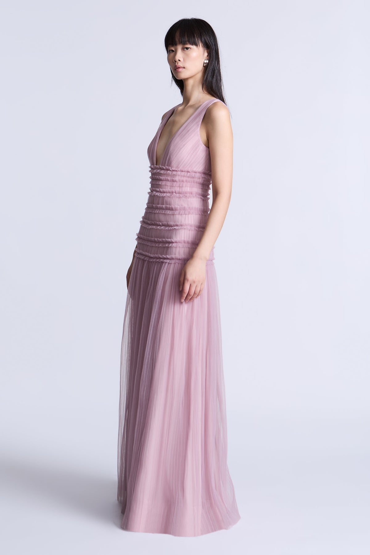 BCBGMAXAZARIA Iris Gown Softly pleated crafted from airy tulle with a fluid weightless feel.