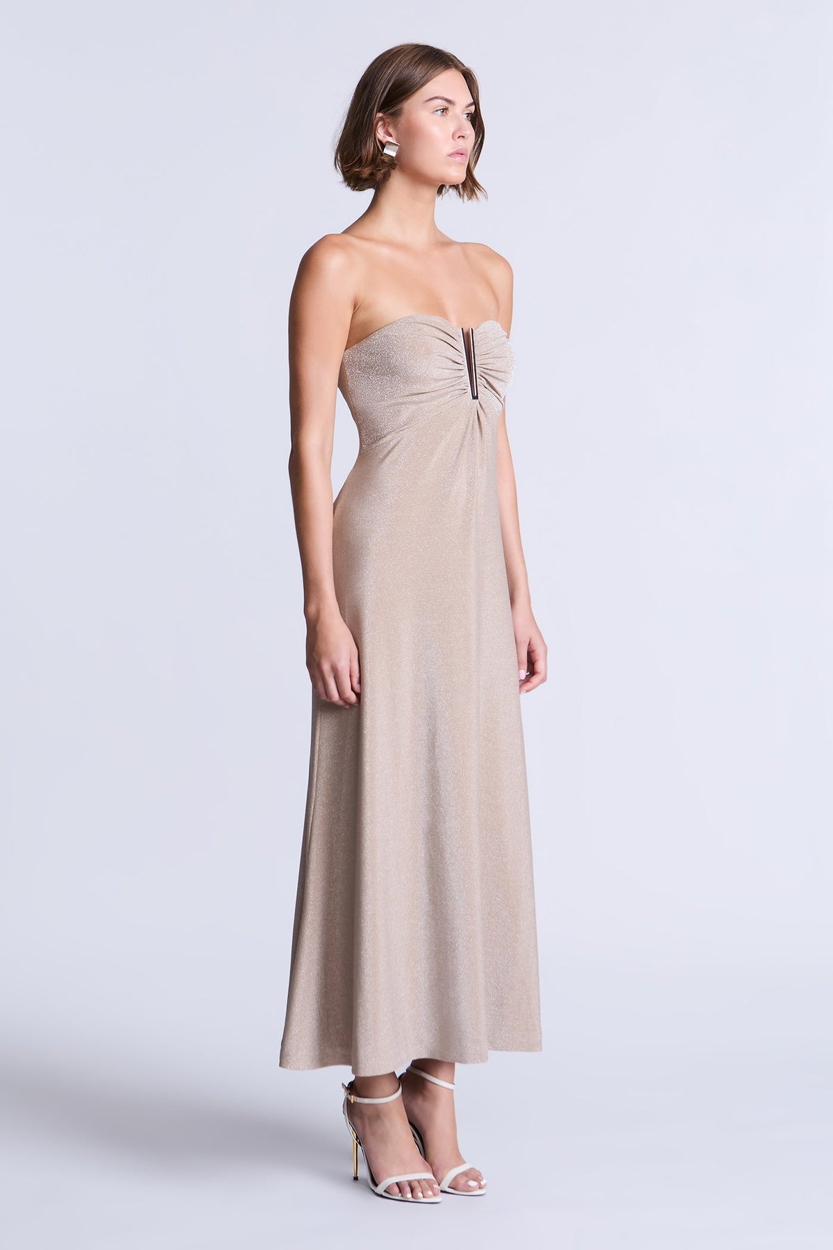 BCBGMAXAZARIA Lola Dress Champagne metallic-knit dress featuring an ankle-length silhouette with an airy fluid flare.