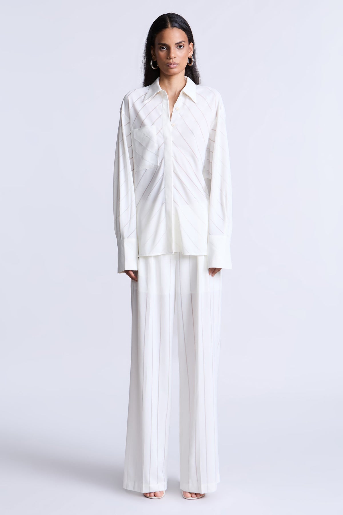 BCBGMAXAZARIA Eden Fluid pinstripe shirt designed with a relaxed drape and subtle