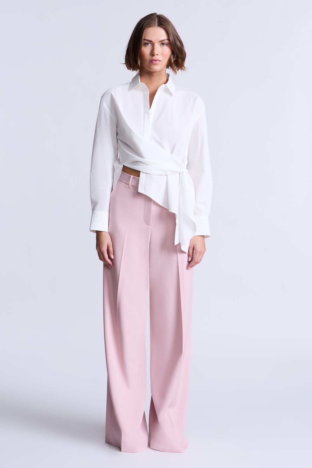 BCBGMAXAZARIA Crisp cotton wrap Tay shirt with a soft breathable feel and an unexpected asymmetric finish