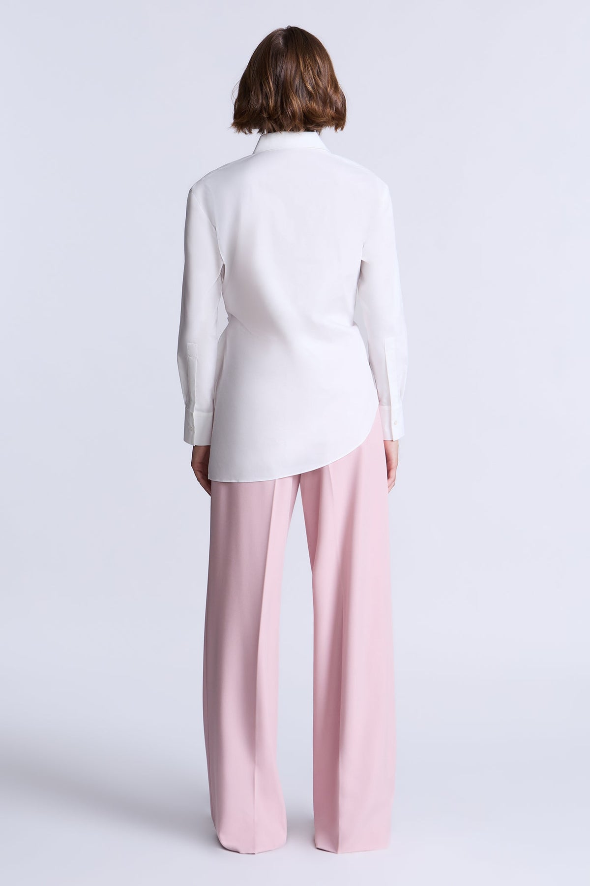 BCBGMAXAZARIA Crisp cotton wrap Tay shirt with a soft breathable feel and an unexpected asymmetric finish