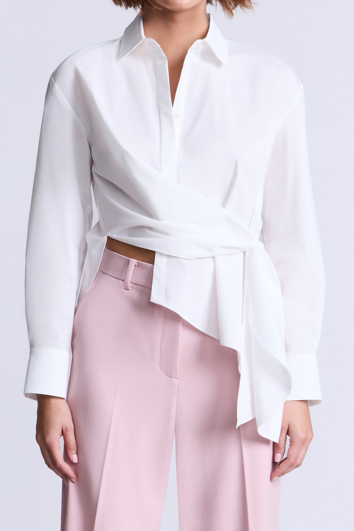 BCBGMAXAZARIA Crisp cotton wrap Tay shirt with a soft breathable feel and an unexpected asymmetric finish