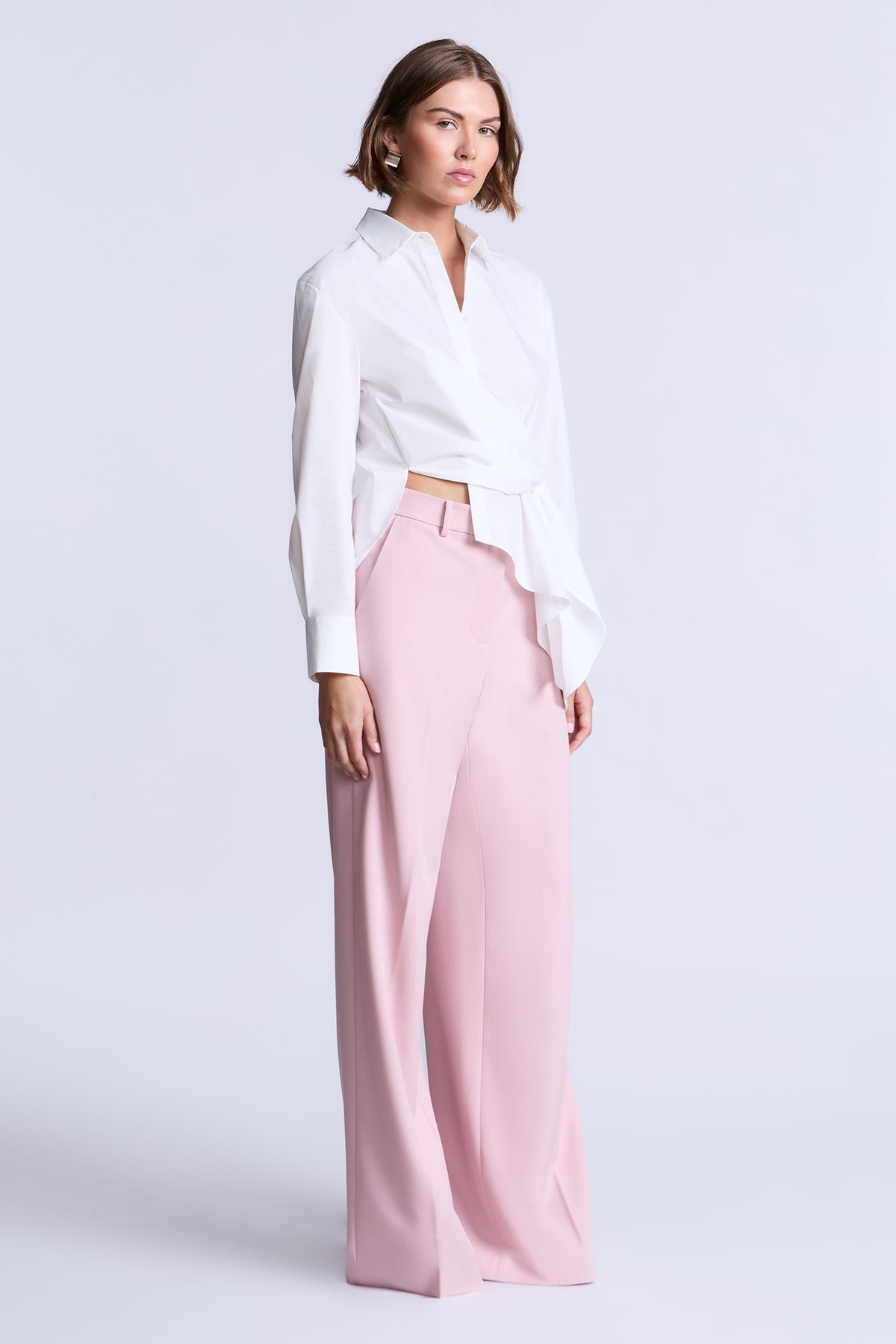 BCBGMAXAZARIA Crisp cotton wrap Tay shirt with a soft breathable feel and an unexpected asymmetric finish