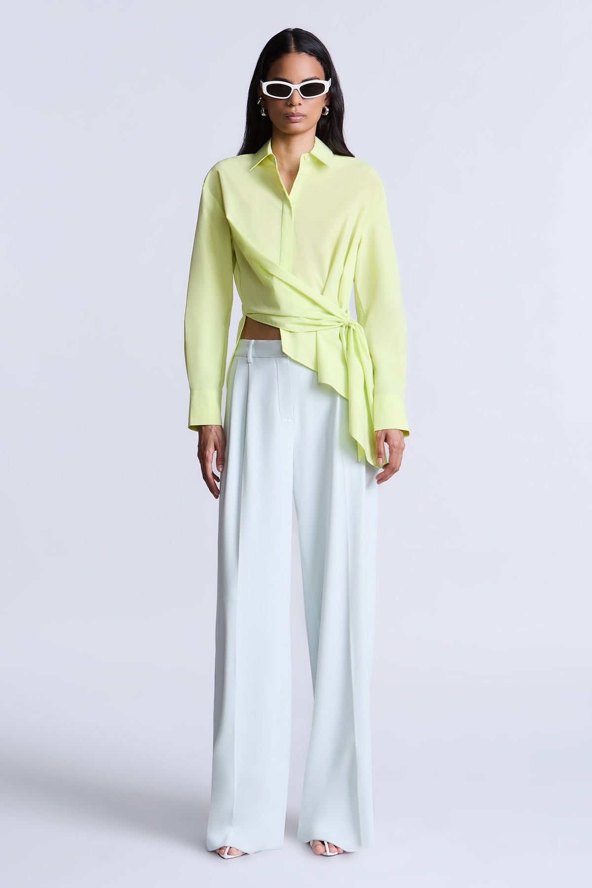 BCBGMAXAZARIA Crisp cotton wrap Tay shirt with a soft breathable feel and an unexpected asymmetric finish