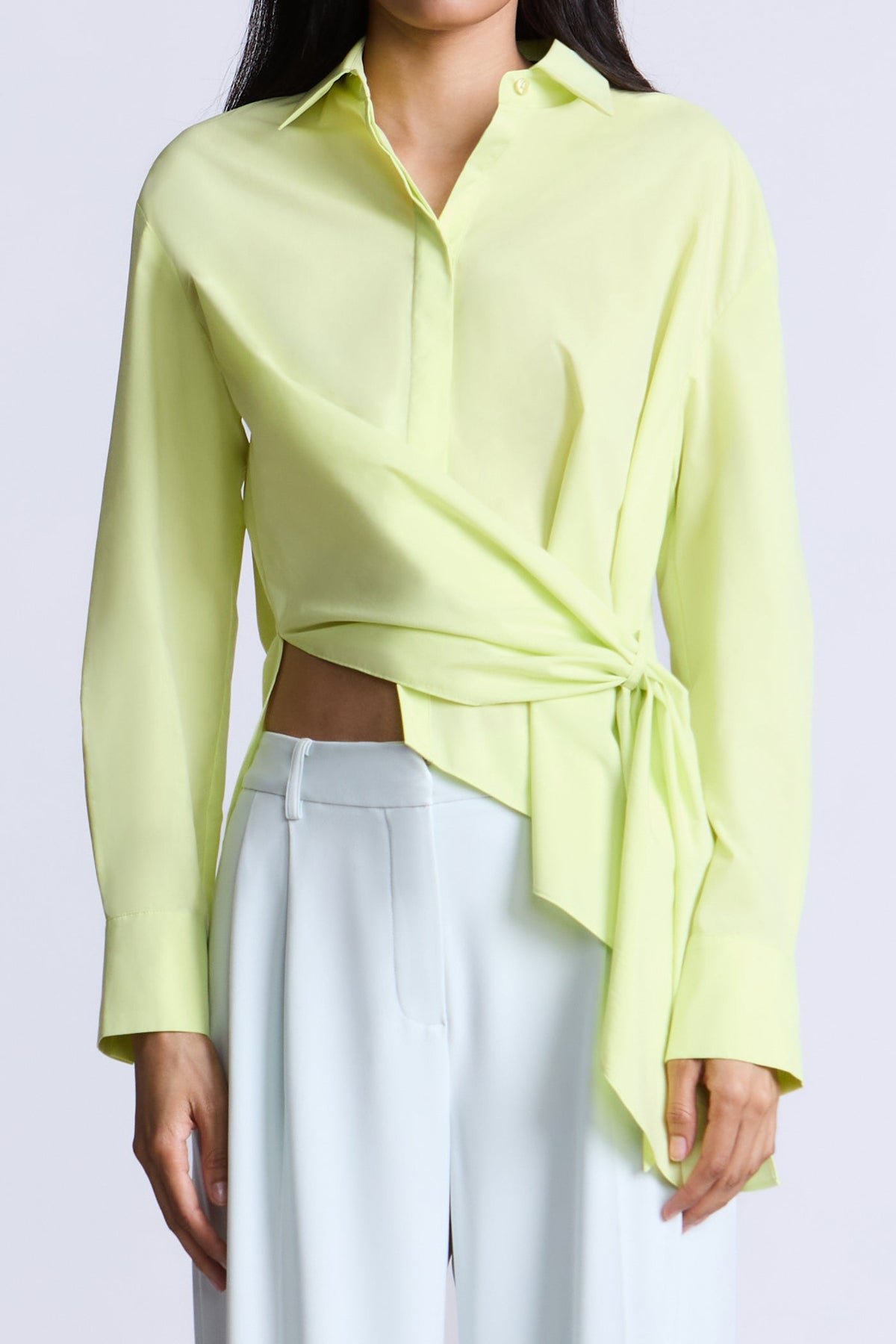 BCBGMAXAZARIA Crisp cotton wrap Tay shirt with a soft breathable feel and an unexpected asymmetric finish