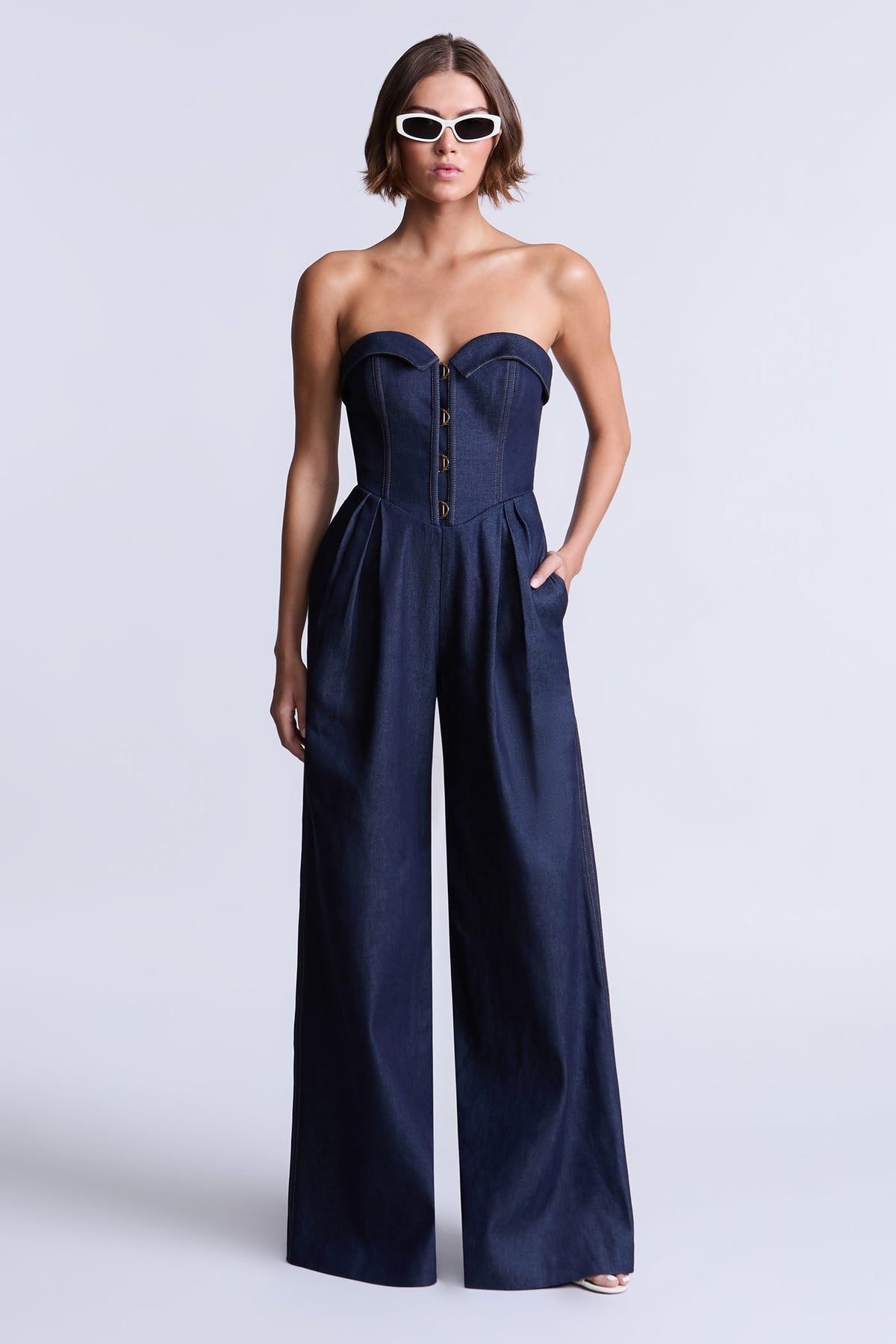 BCBGMAXAZARIA Savannah Strapless denim jumpsuit with a sculpted corset-inspired bodice