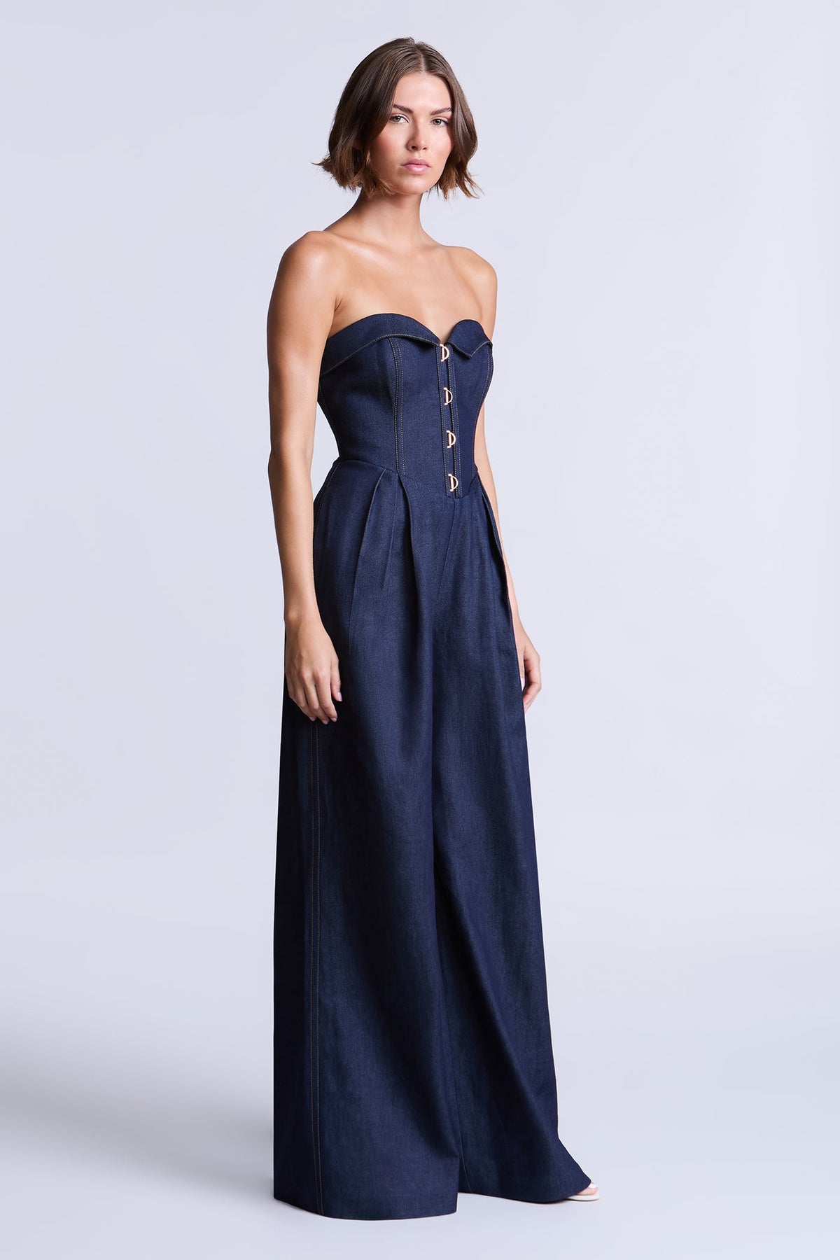 BCBGMAXAZARIA Savannah Strapless denim jumpsuit with a sculpted corset-inspired bodice