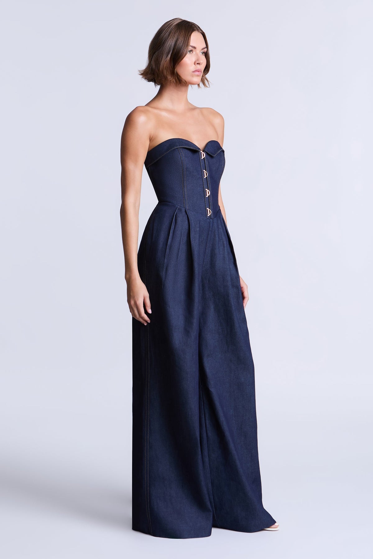 BCBGMAXAZARIA Savannah Strapless denim jumpsuit with a sculpted corset-inspired bodice