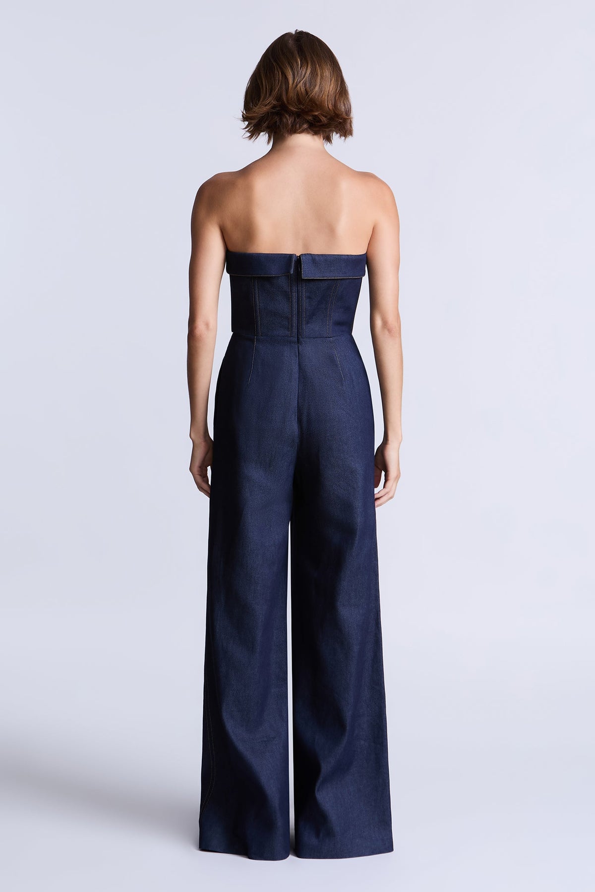 BCBGMAXAZARIA Savannah Strapless denim jumpsuit with a sculpted corset-inspired bodice